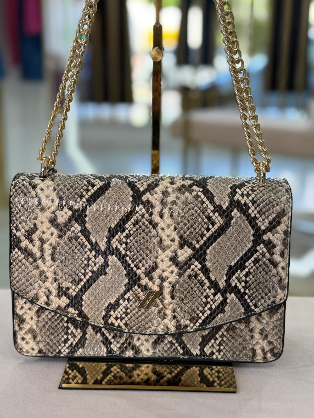 Mala tiracolo padrão cobra