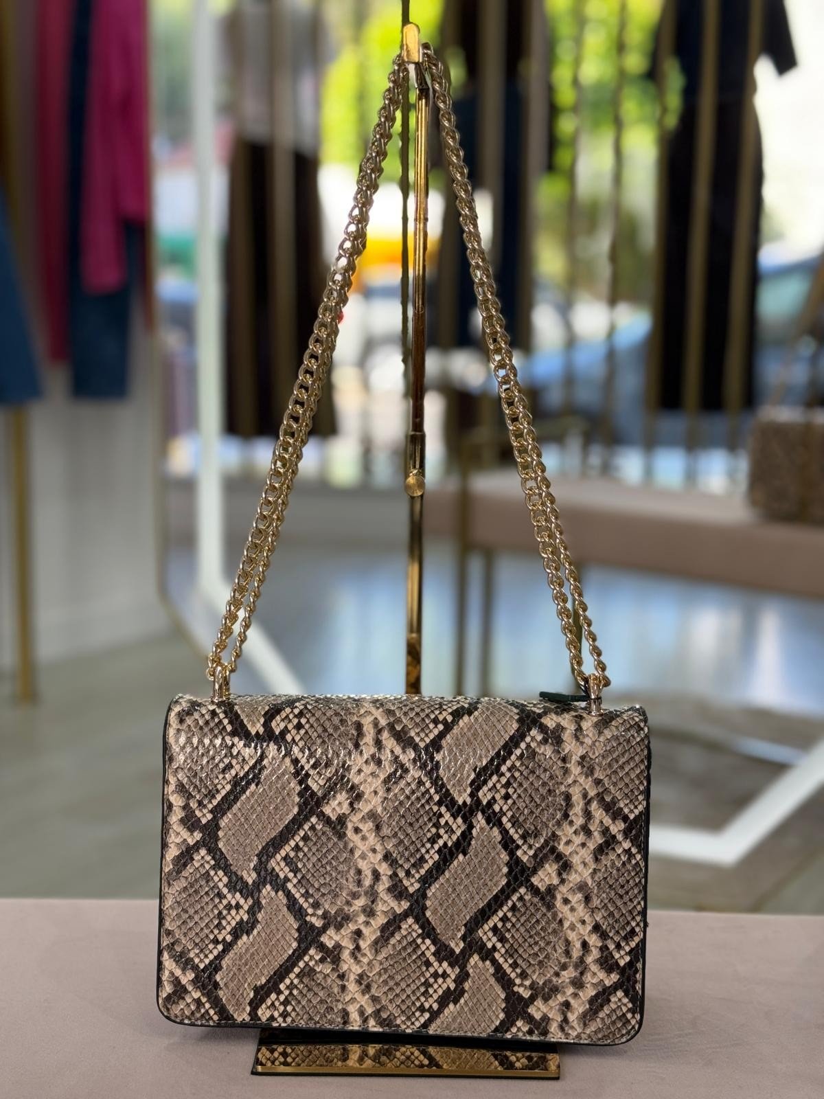 Mala tiracolo padrão cobra