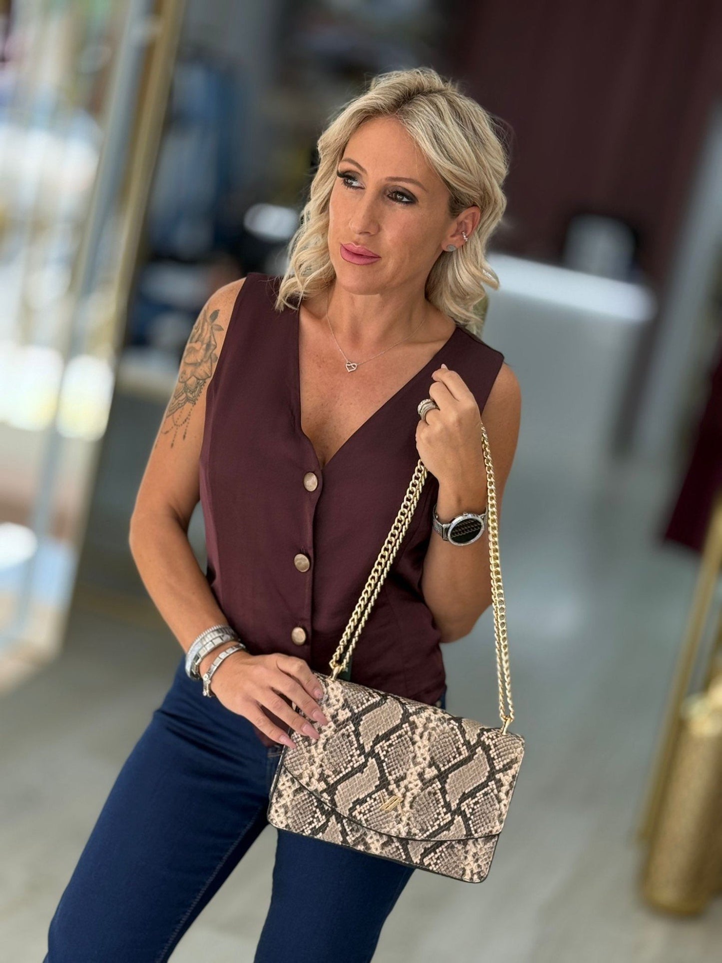 Mala tiracolo padrão cobra