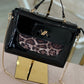 Mala verniz com animal print