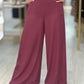 Calça pantalona de cintura subida