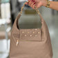 Mala macia com tachas