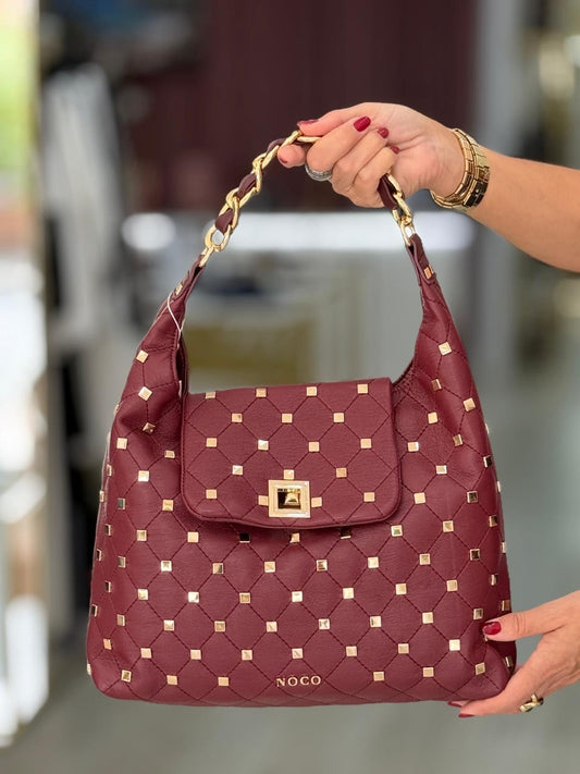Mala macia com tachas