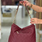Mala tipo saco com tachas