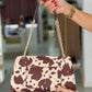 Bolsa a tiracolo com aba e estampado