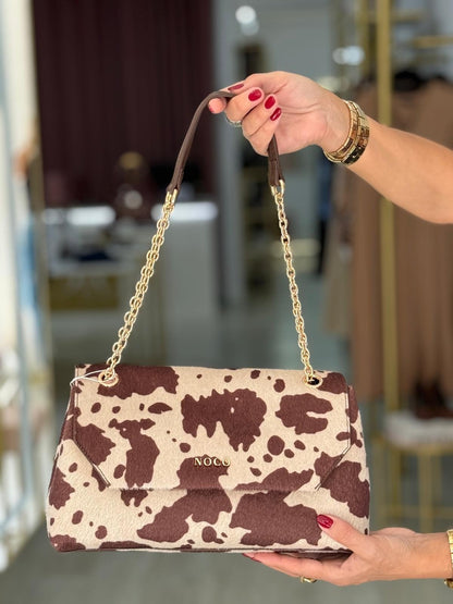 Bolsa a tiracolo com aba e estampado