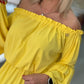 Vestido sem ombros com manga