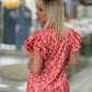 Vestido estampado com manga em folhos