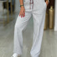 Calças jogger em cinzento claro com cintura contrastante