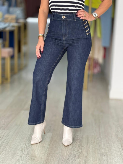 Calças de ganga correntes douradas